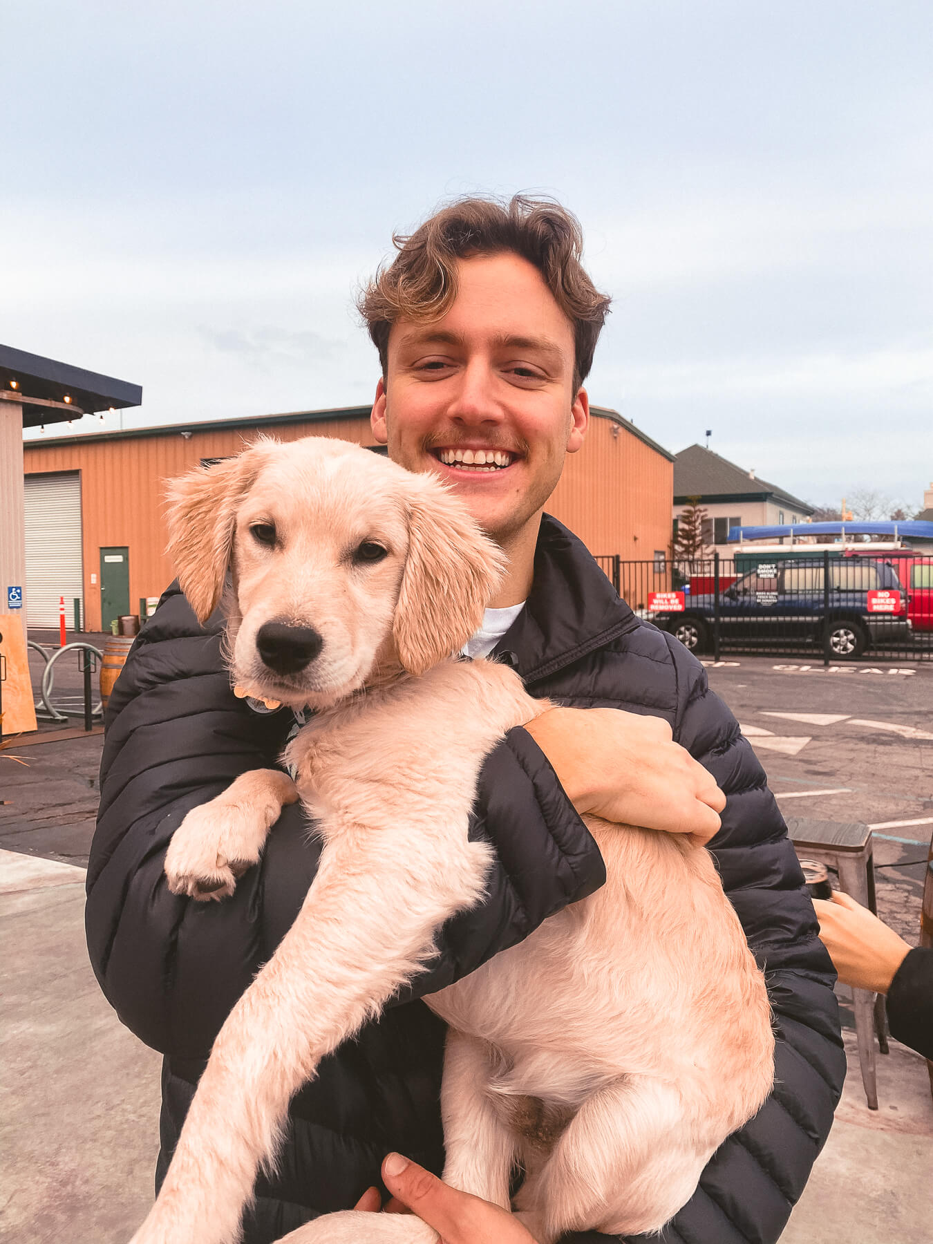 Cade holding a puppy